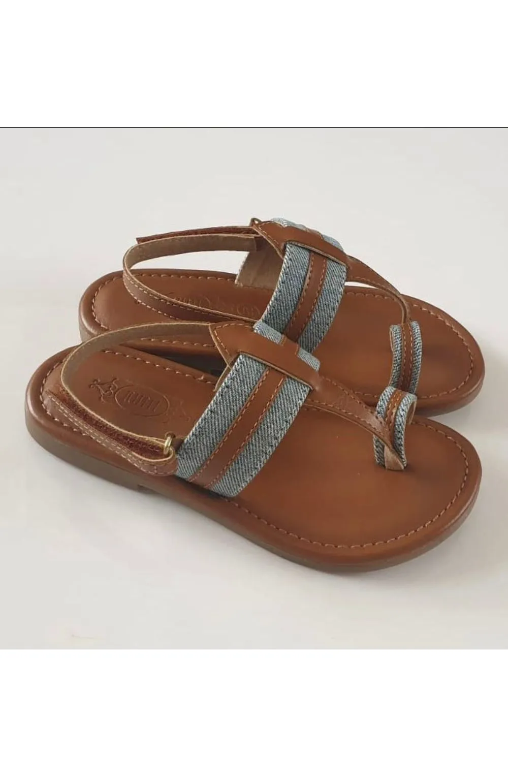 Denim and tan kolhapuri flats
