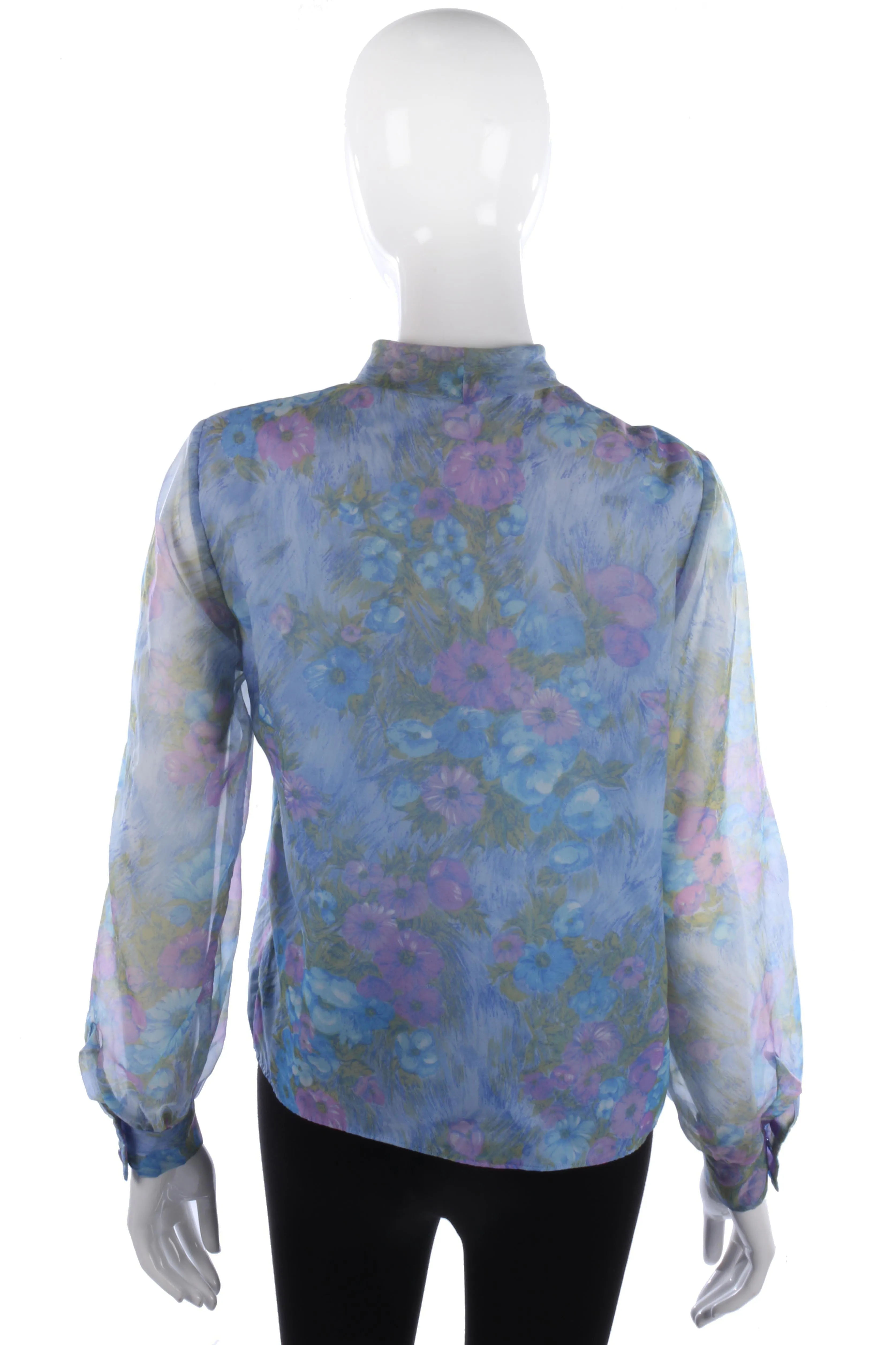 Lovely vintage blue floral blouse with a tie neck